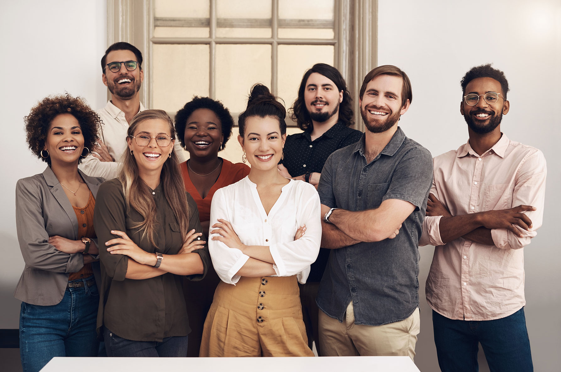 Smiling startup entrepreneurs standing together.